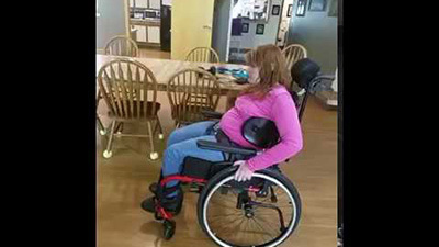 Amanda uses her Dynamic Back to rock and to help propel her wheelchair