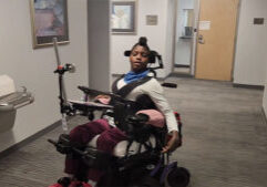 Naomi Drives Power Wheelchair with Dynamic Seating Assist